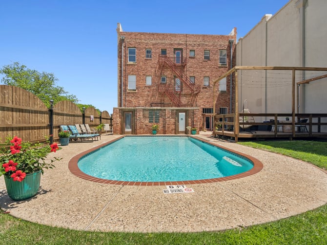 The Eastland Historic Hotel pool and brick building exterior